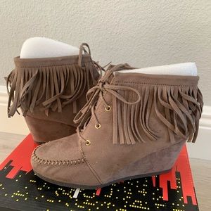 Never worn Moccasin boots